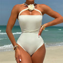 Strapless swimsuit with adjustable ties and flower