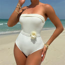 Strapless swimsuit with adjustable ties and flower